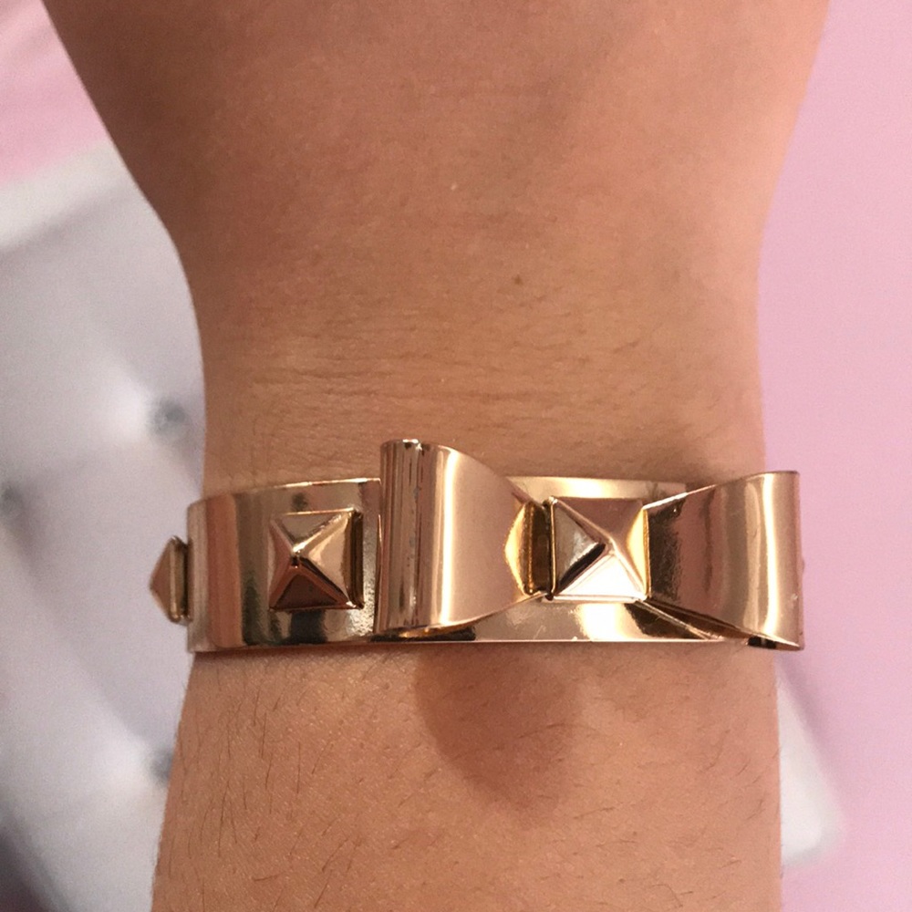 Gold bow and rock stud bracelet